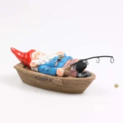 Nain de jardin en résine ballade sur l'eau (Barque allongé)