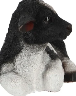Veau noir et blanc couché en résine (Petit modèle)