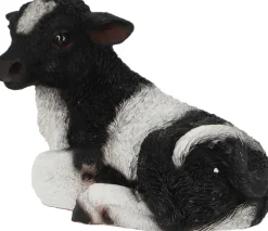 Veau noir et blanc couché en résine (Petit modèle)